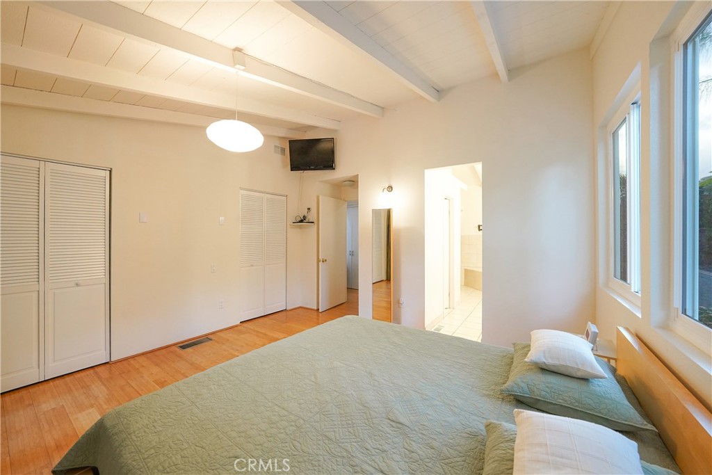 23734 Vista Ramona Road Ramona, CA 92065 - Photo 44 of 62 a bedroom with a bed and a window