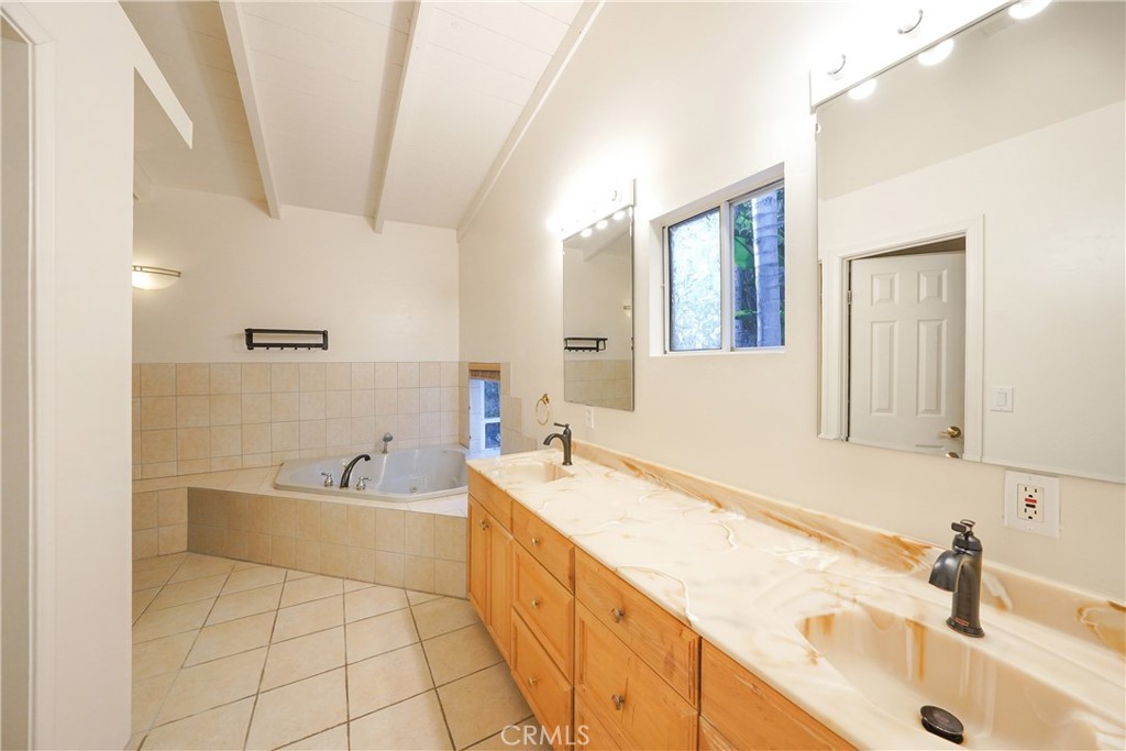 23734 Vista Ramona Road Ramona, CA 92065 - Photo 45 of 62 a spacious bathroom with a tub sink and mirror