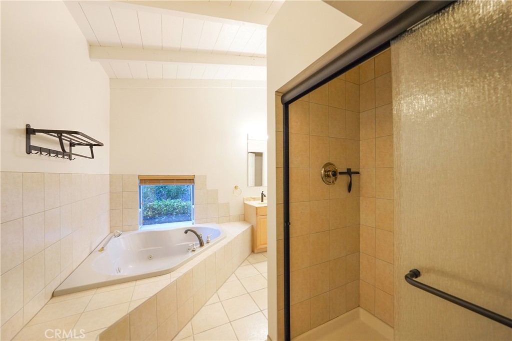 23734 Vista Ramona Road Ramona, CA 92065 - Photo 46 of 62 a bathroom with a tub shower and a sink