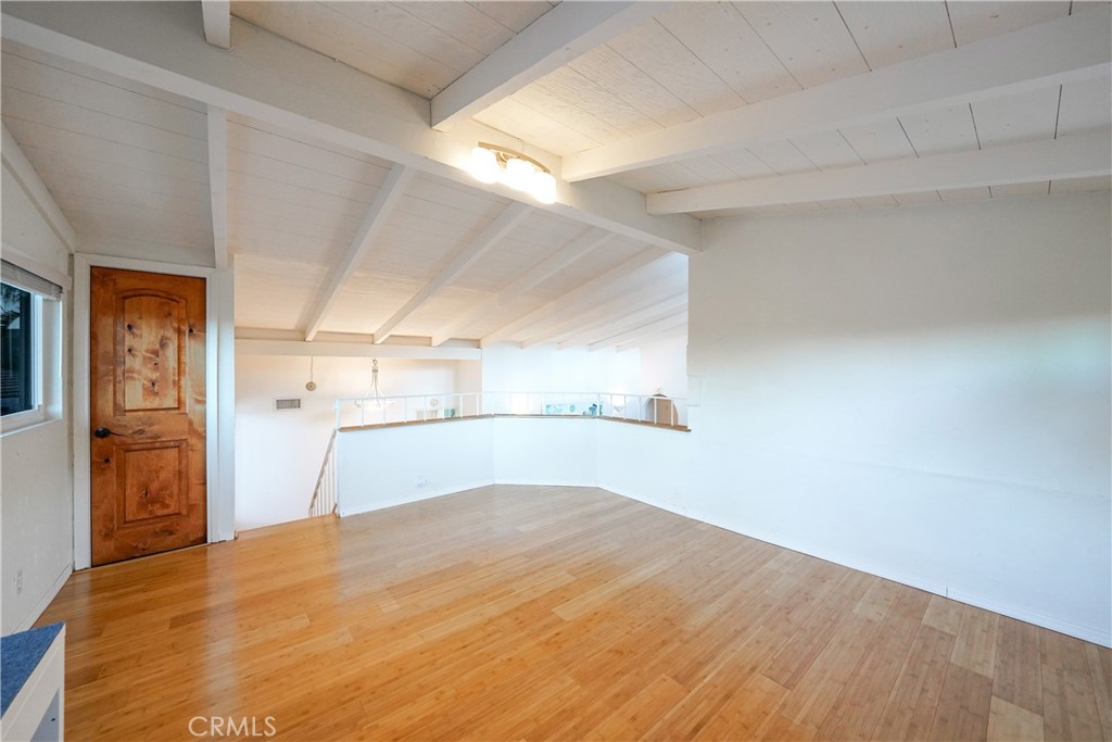 23734 Vista Ramona Road Ramona, CA 92065 - Photo 48 of 62 a bedroom with a bed and painting on the wall