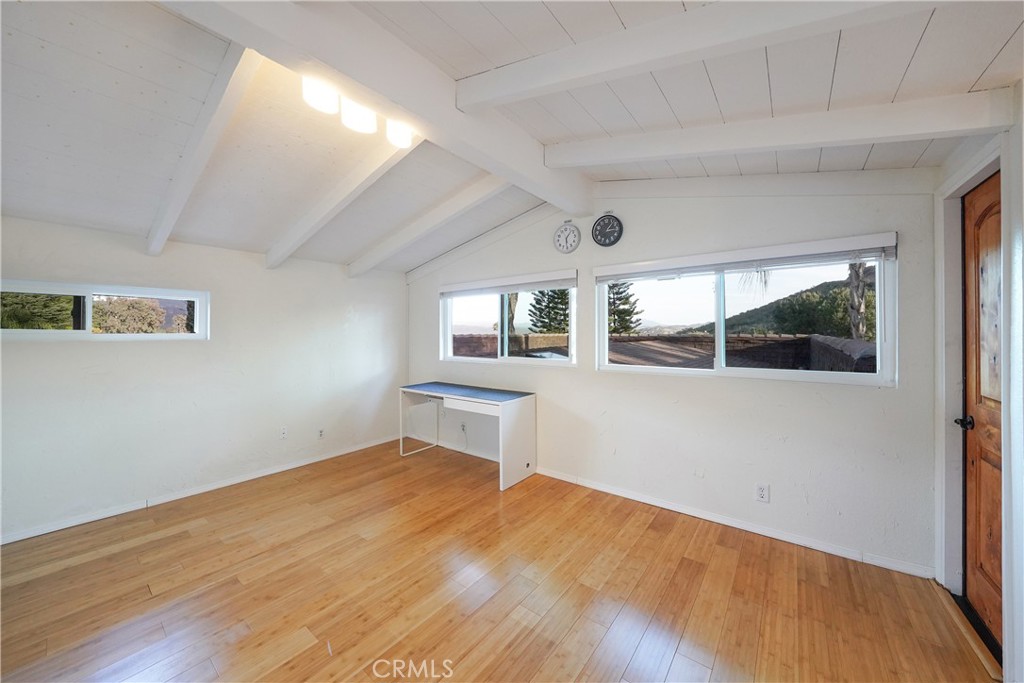 23734 Vista Ramona Road Ramona, CA 92065 - Photo 49 of 62 a view of empty room with wooden floor and fan