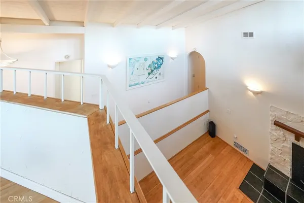 an aerial view of a house with garden space and street view