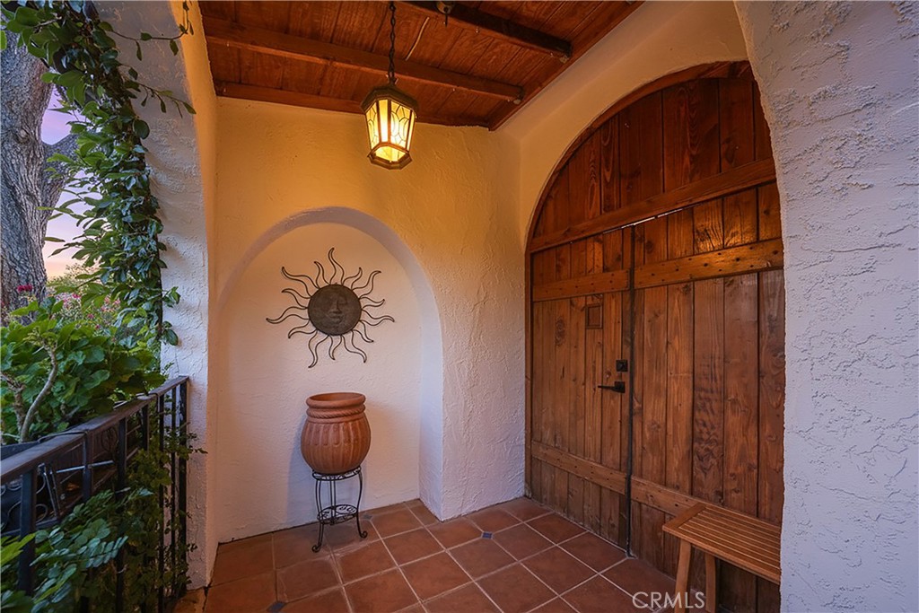 23734 Vista Ramona Road Ramona, CA 92065 - Photo 8 of 62 a view of a door and chair in the patio