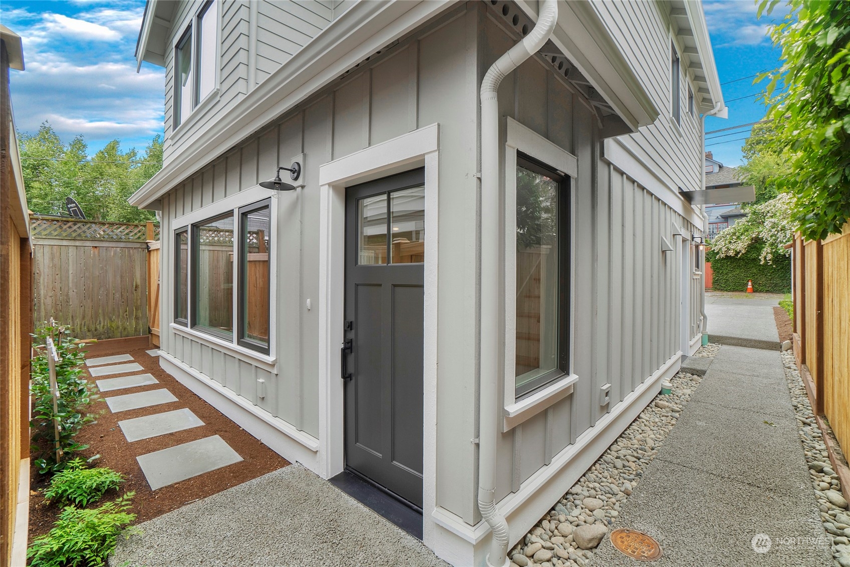 a view of a pathway of a house with a glass door