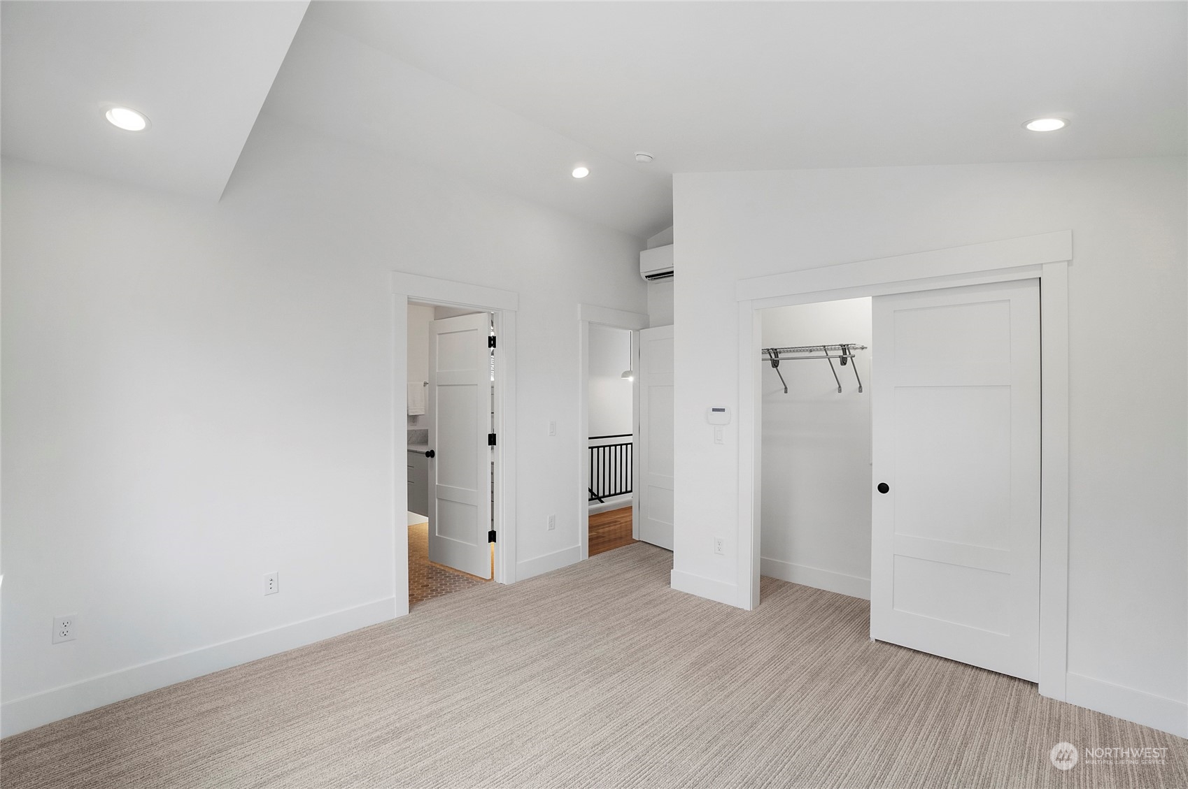 1619 3rd Avenue West Seattle, WA 98119 - Photo 12 of 28 a view of an empty room with wooden floor and closet