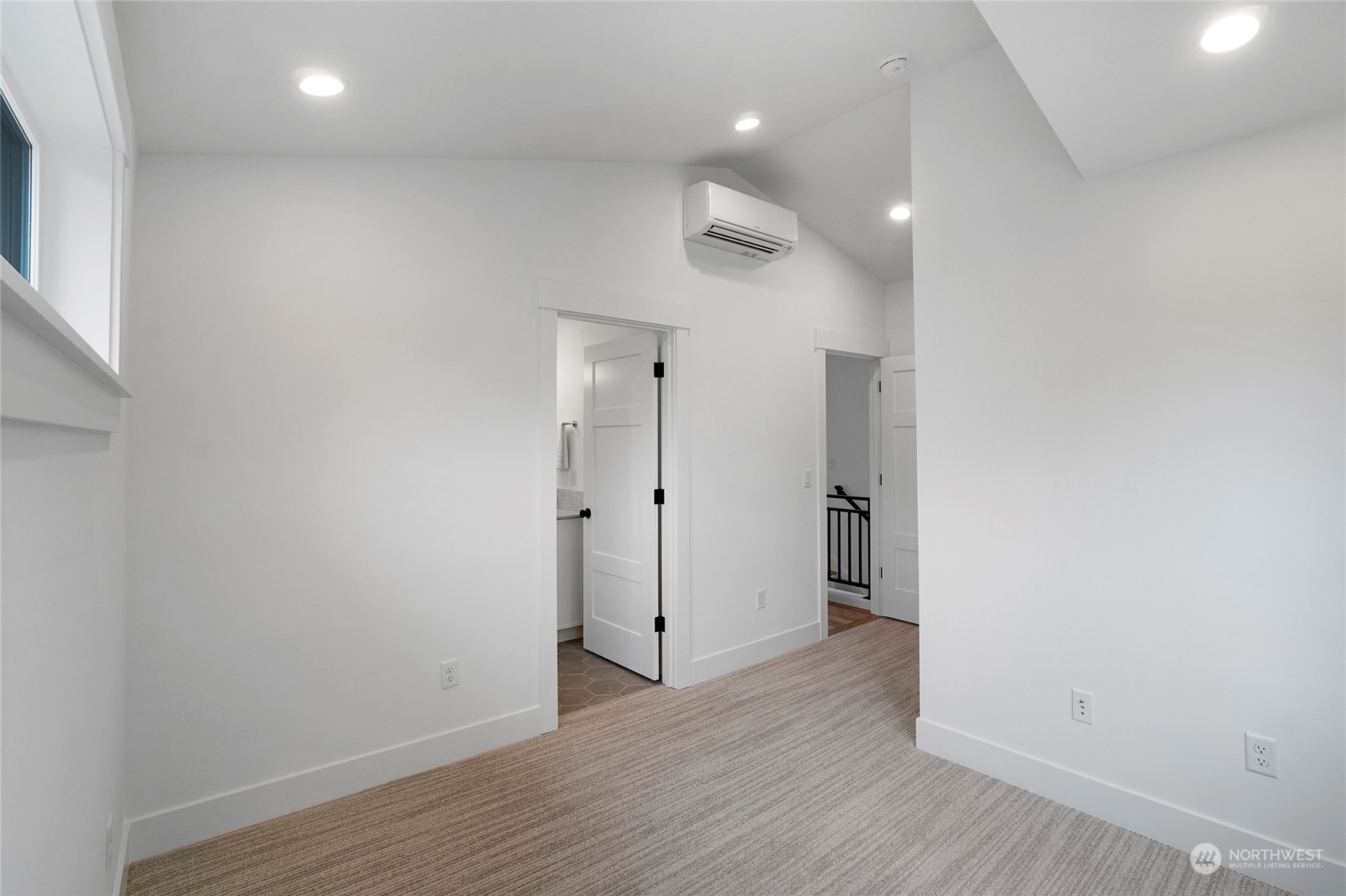 1619 3rd Avenue West Seattle, WA 98119 - Photo 16 of 28 a view of an empty room with wooden floor
