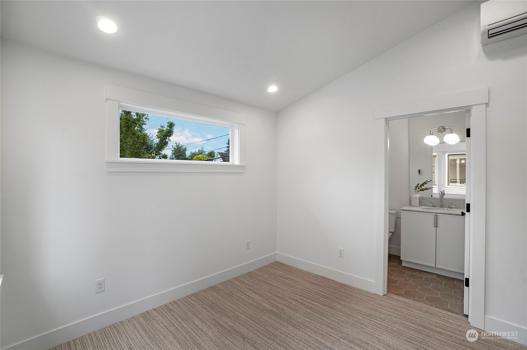 1619 3rd Avenue West Seattle, WA 98119 - Photo 17 of 28 a view of room with window and wooden floor