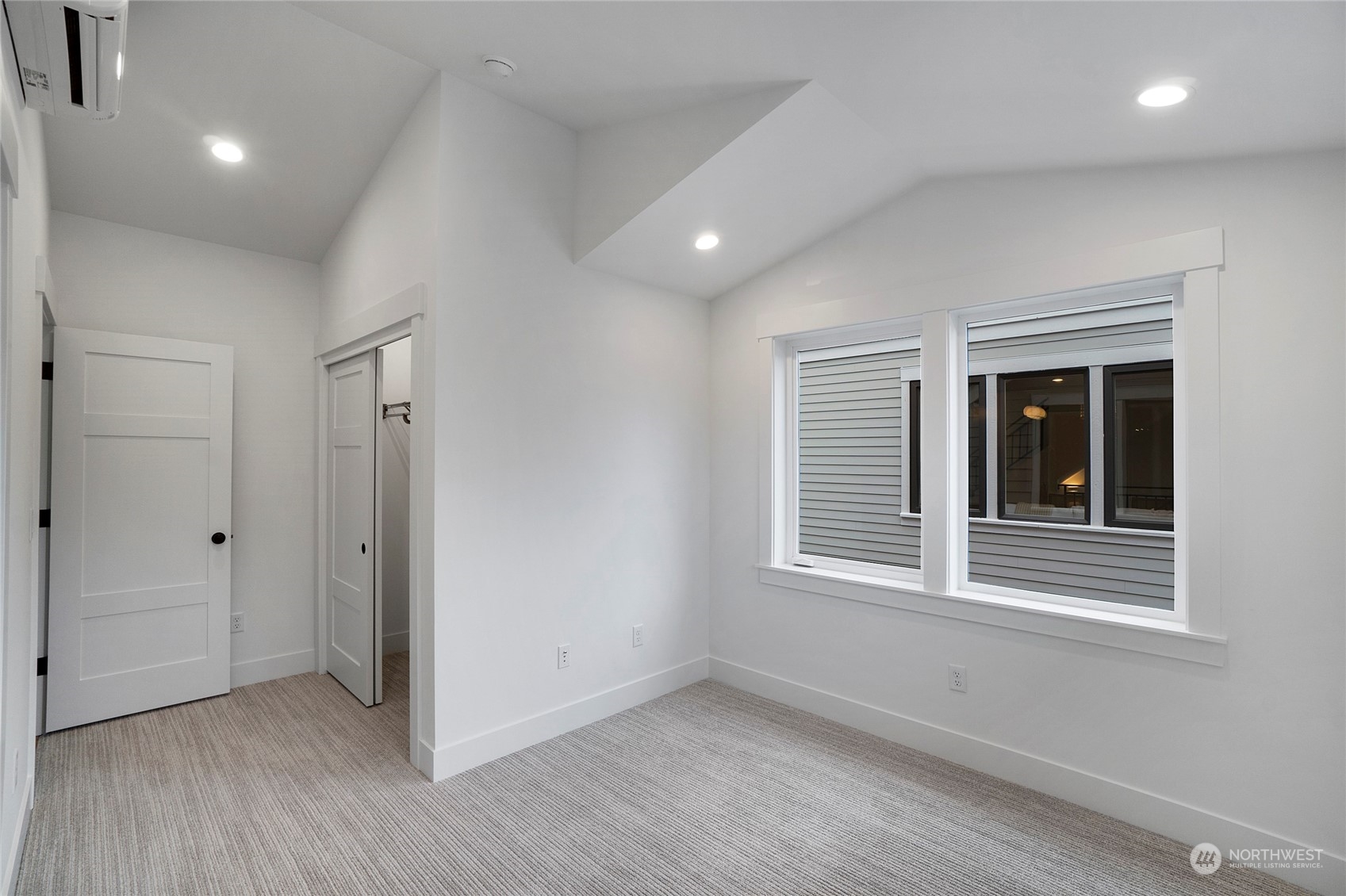 1619 3rd Avenue West Seattle, WA 98119 - Photo 18 of 28 an empty room with wooden floor and windows