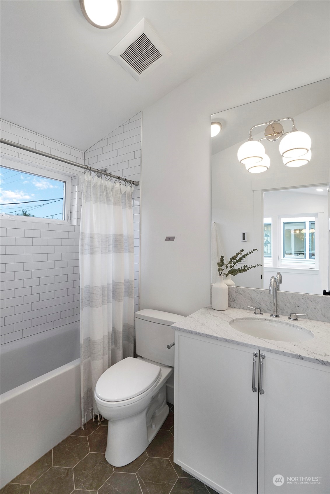 1619 3rd Avenue West Seattle, WA 98119 - Photo 19 of 28 a bathroom with a sink a toilet and shower