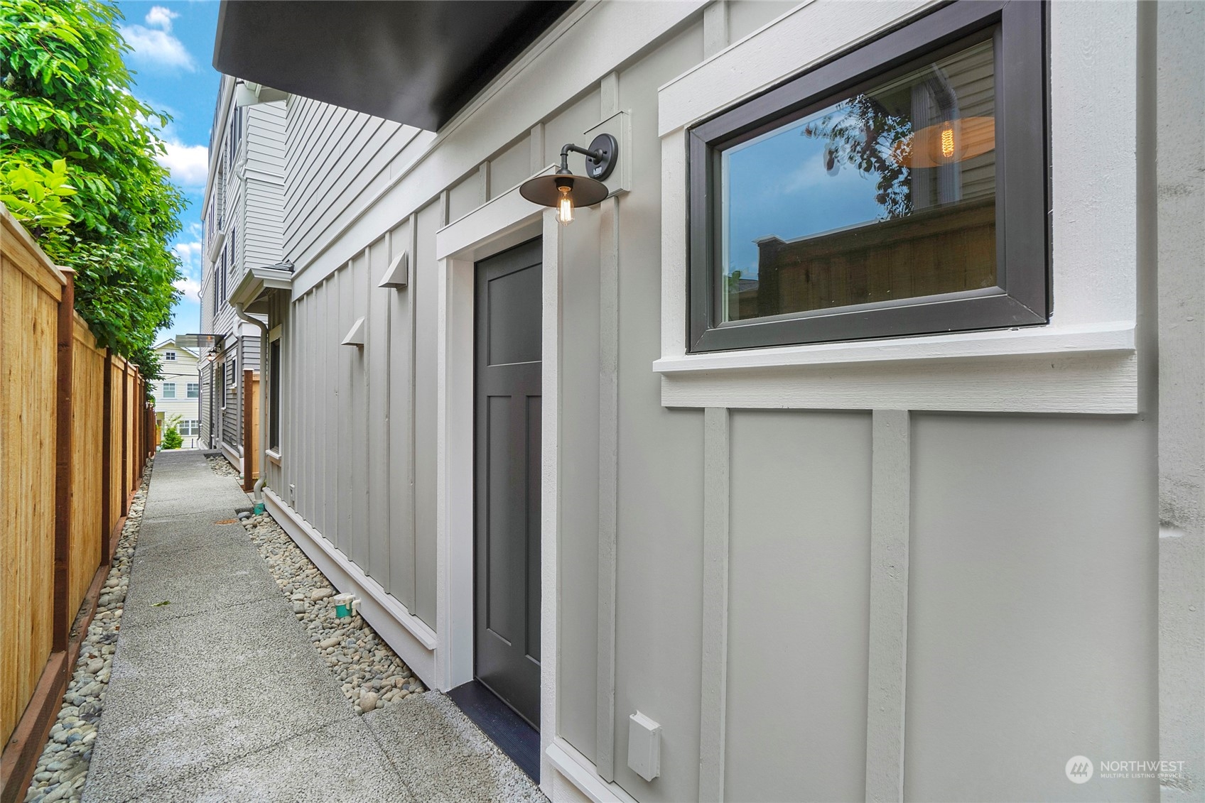 1619 3rd Avenue West Seattle, WA 98119 - Photo 21 of 28 a view of a door and a window of the house