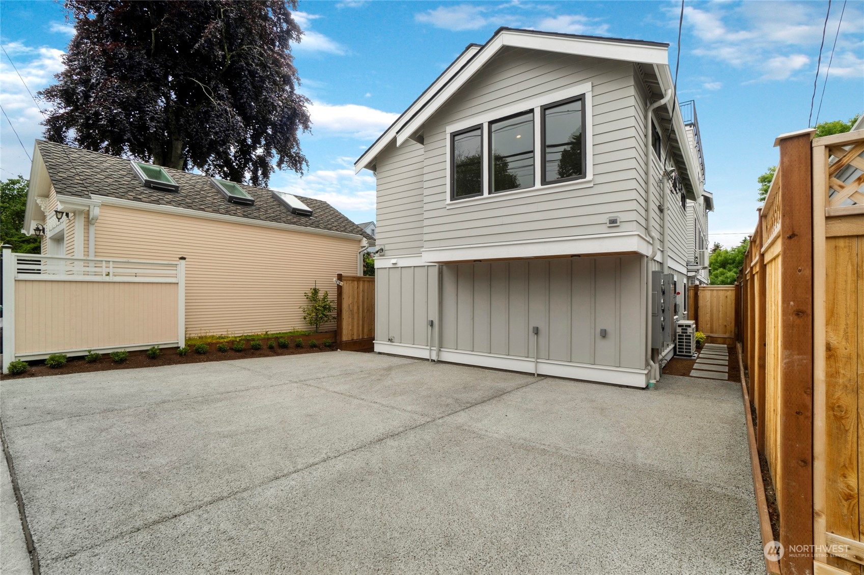 1619 3rd Avenue West Seattle, WA 98119 - Photo 24 of 28 a front view of a house with a garage