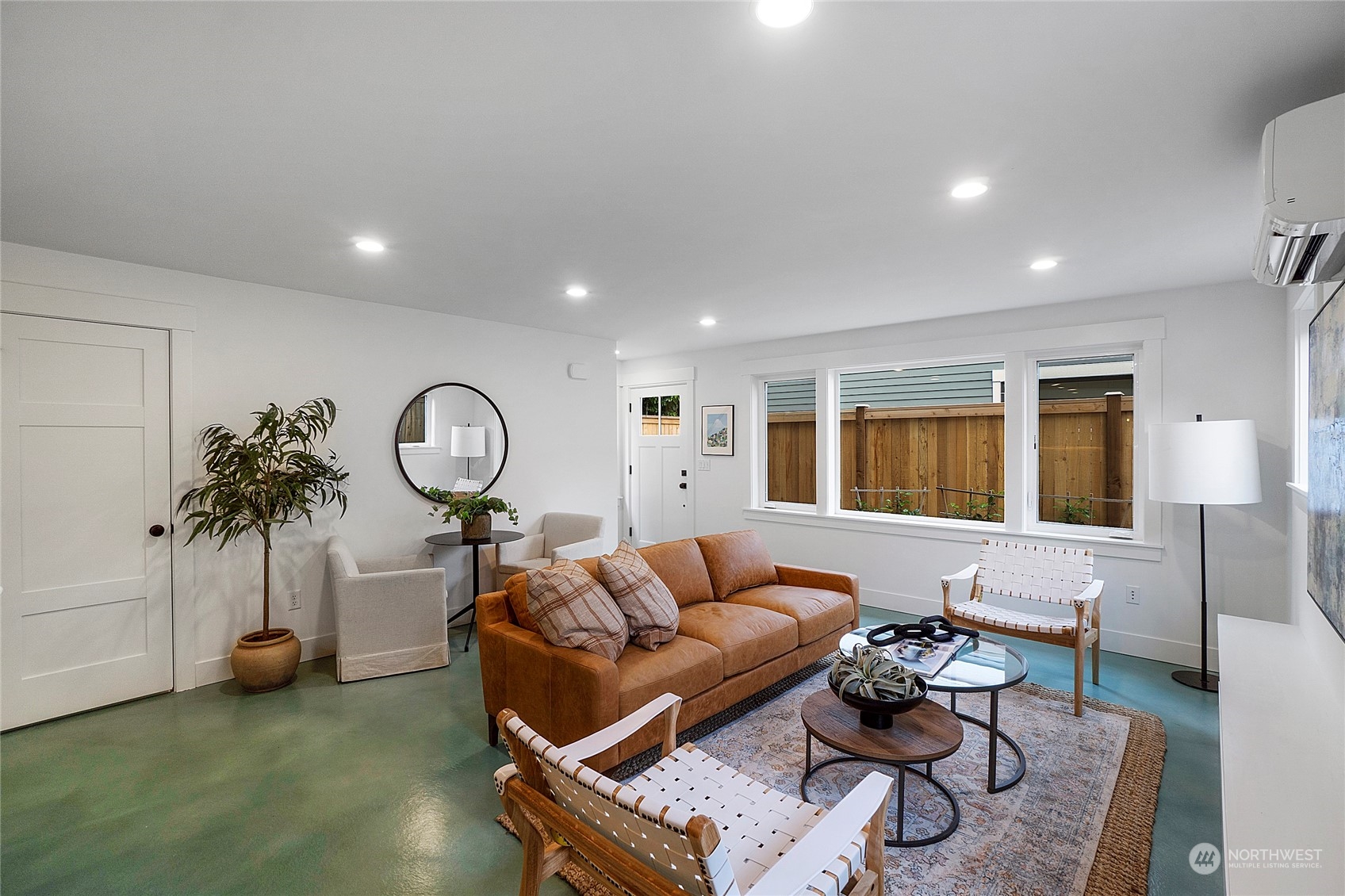 1619 3rd Avenue West Seattle, WA 98119 - Photo 4 of 28 a living room with furniture and a large window