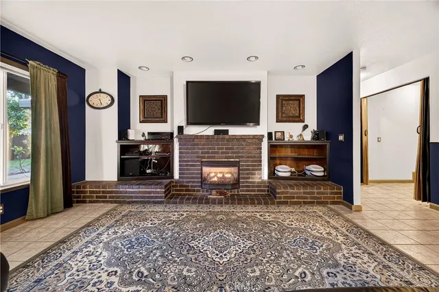 a bathroom with a granite countertop sink a toilet and a mirror