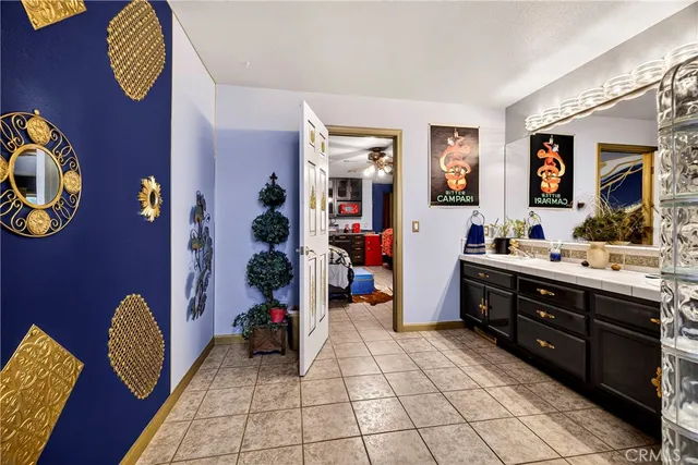 a bedroom with furniture and a book shelf