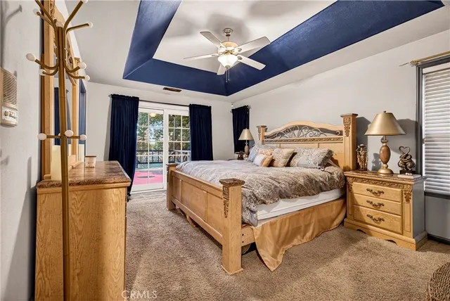 a view of a patio with table and chairs near a yard