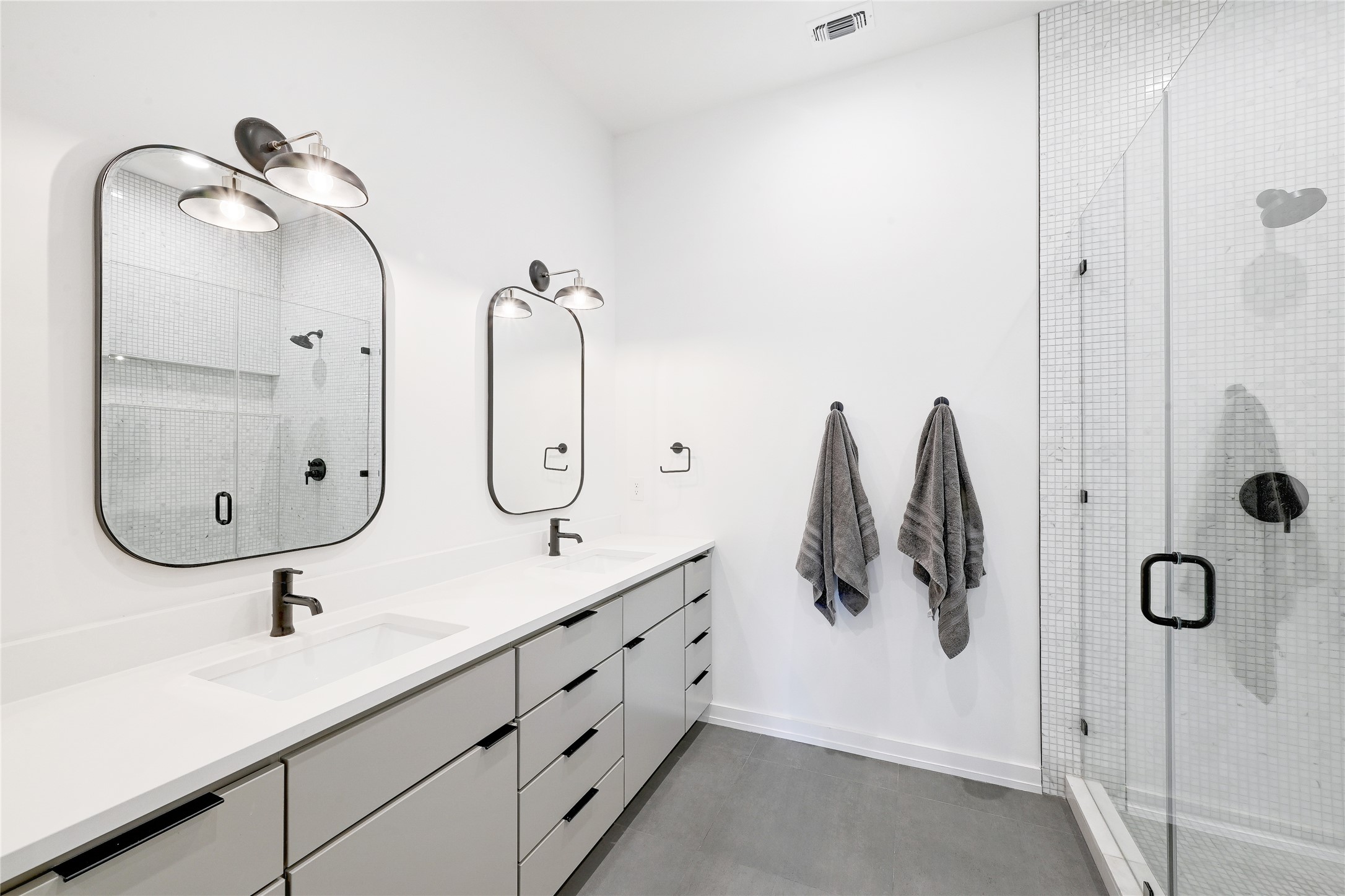 410 West Alpine Road, Unit 7 Austin, TX 78704 - Photo 12 of 26 a bathroom with a double vanity sink and a mirror