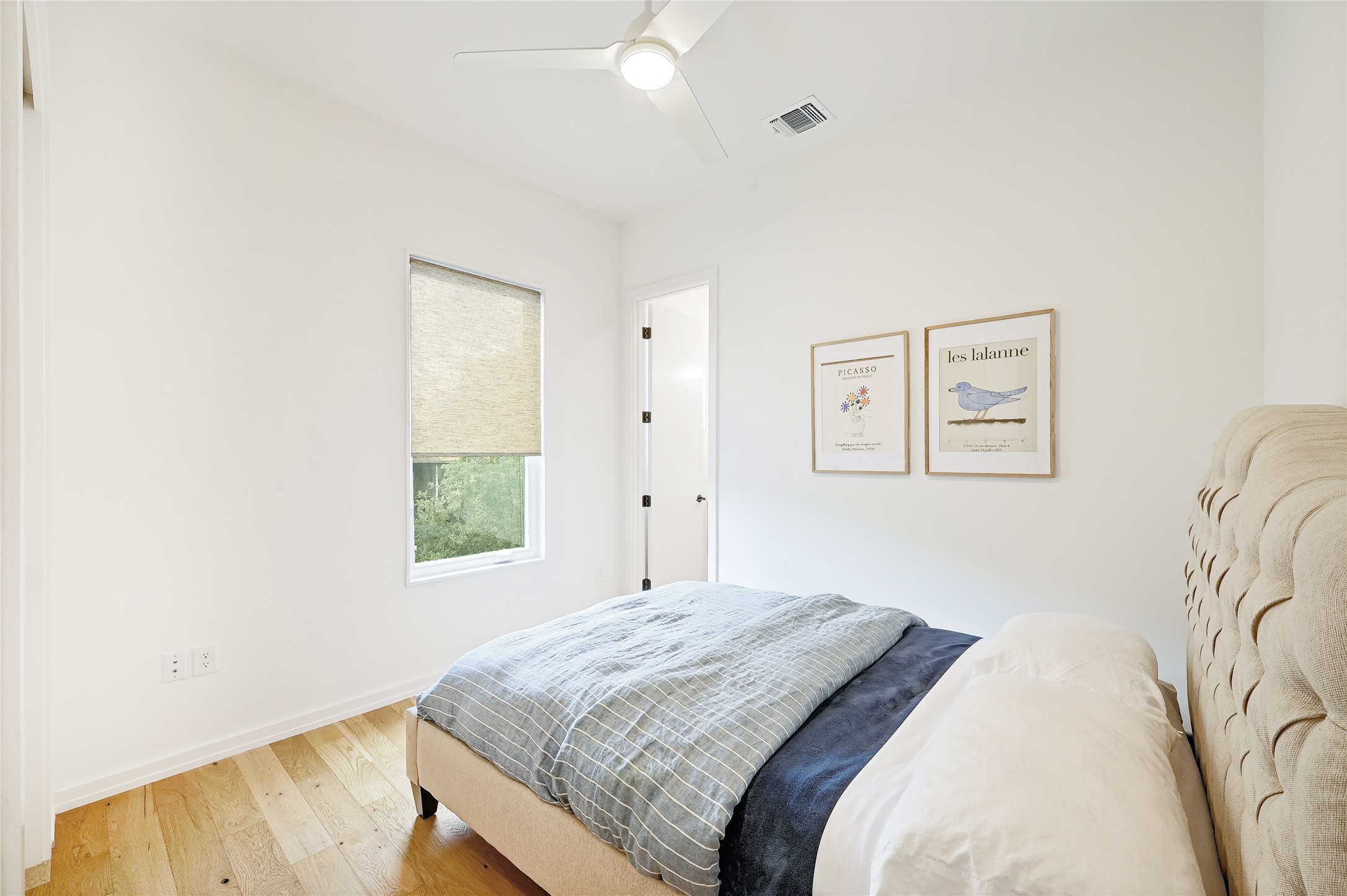 410 West Alpine Road, Unit 7 Austin, TX 78704 - Photo 14 of 26 a bedroom with a bed and a couch