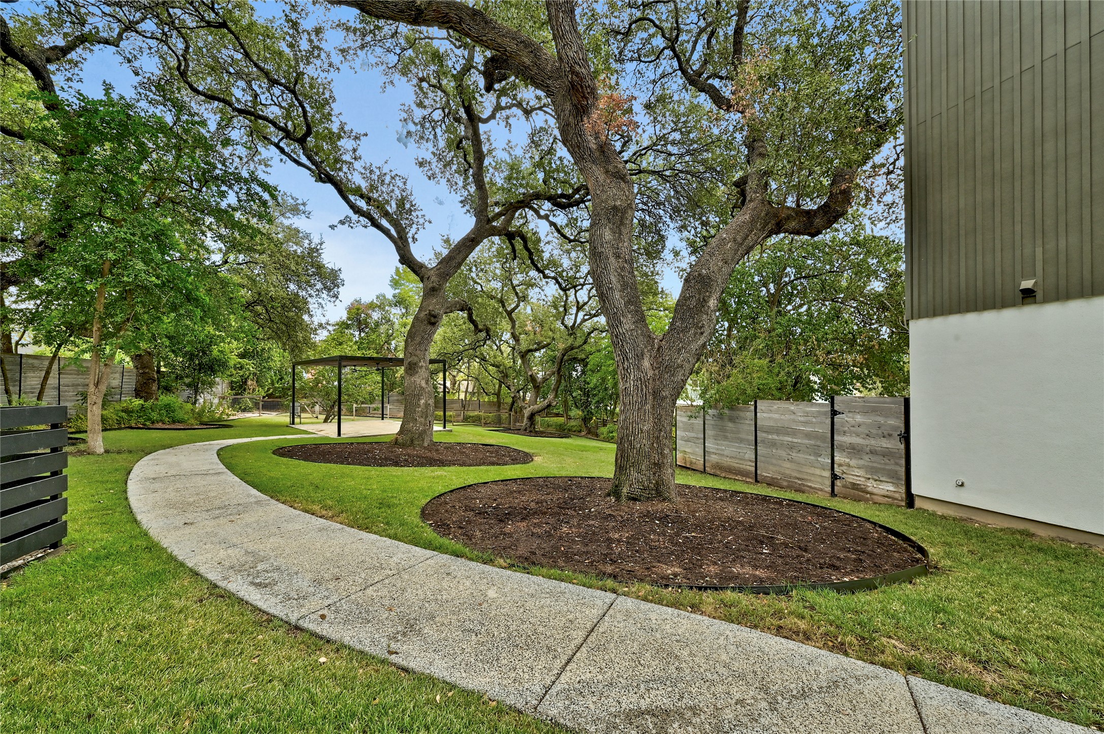 410 West Alpine Road, Unit 7 Austin, TX 78704 - Photo 21 of 26 a view of a backyard with tree s
