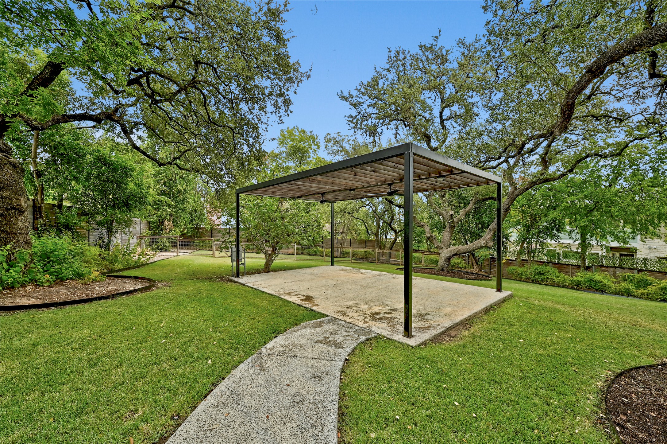 410 West Alpine Road, Unit 7 Austin, TX 78704 - Photo 22 of 26 a view of a garden with a slide