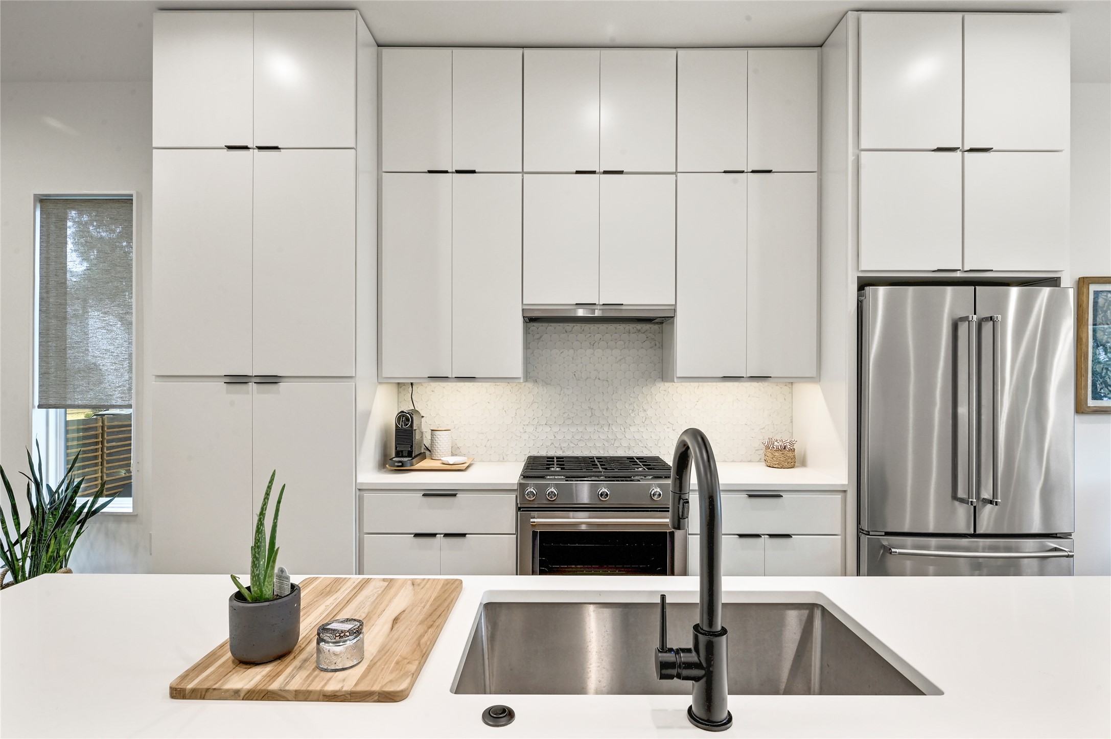 410 West Alpine Road, Unit 7 Austin, TX 78704 - Photo 8 of 26 a kitchen with kitchen island a counter top space appliances and cabinets