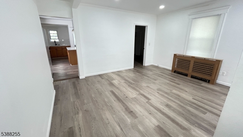 354 West 2nd Street Bound Brook, NJ 08805 - Photo 2 of 10 a view of an empty room with wooden floor and a window