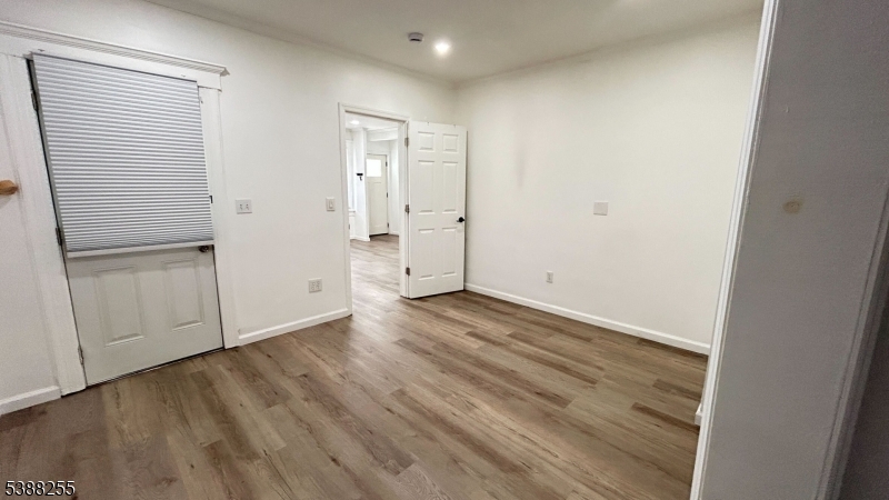 354 West 2nd Street Bound Brook, NJ 08805 - Photo 6 of 10 a view of an empty room with wooden floor