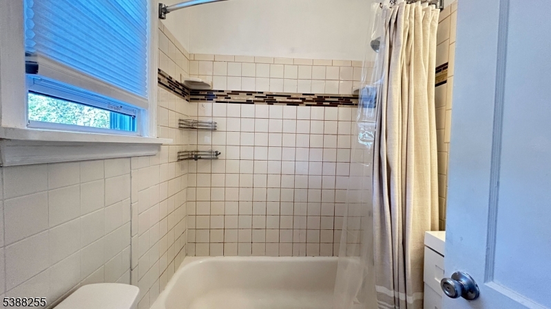 354 West 2nd Street Bound Brook, NJ 08805 - Photo 8 of 10 a bathroom with a shower and a bathtub
