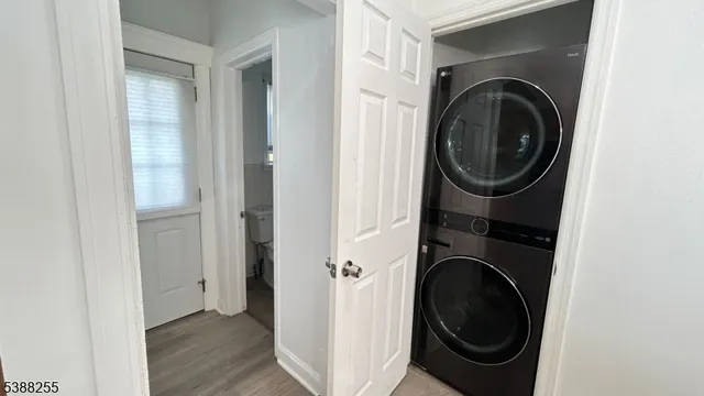 a view of a hallway with washer and dryer