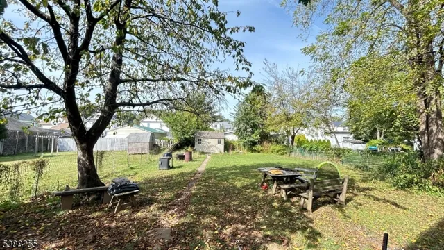 a view of outdoor space with garden and trees
