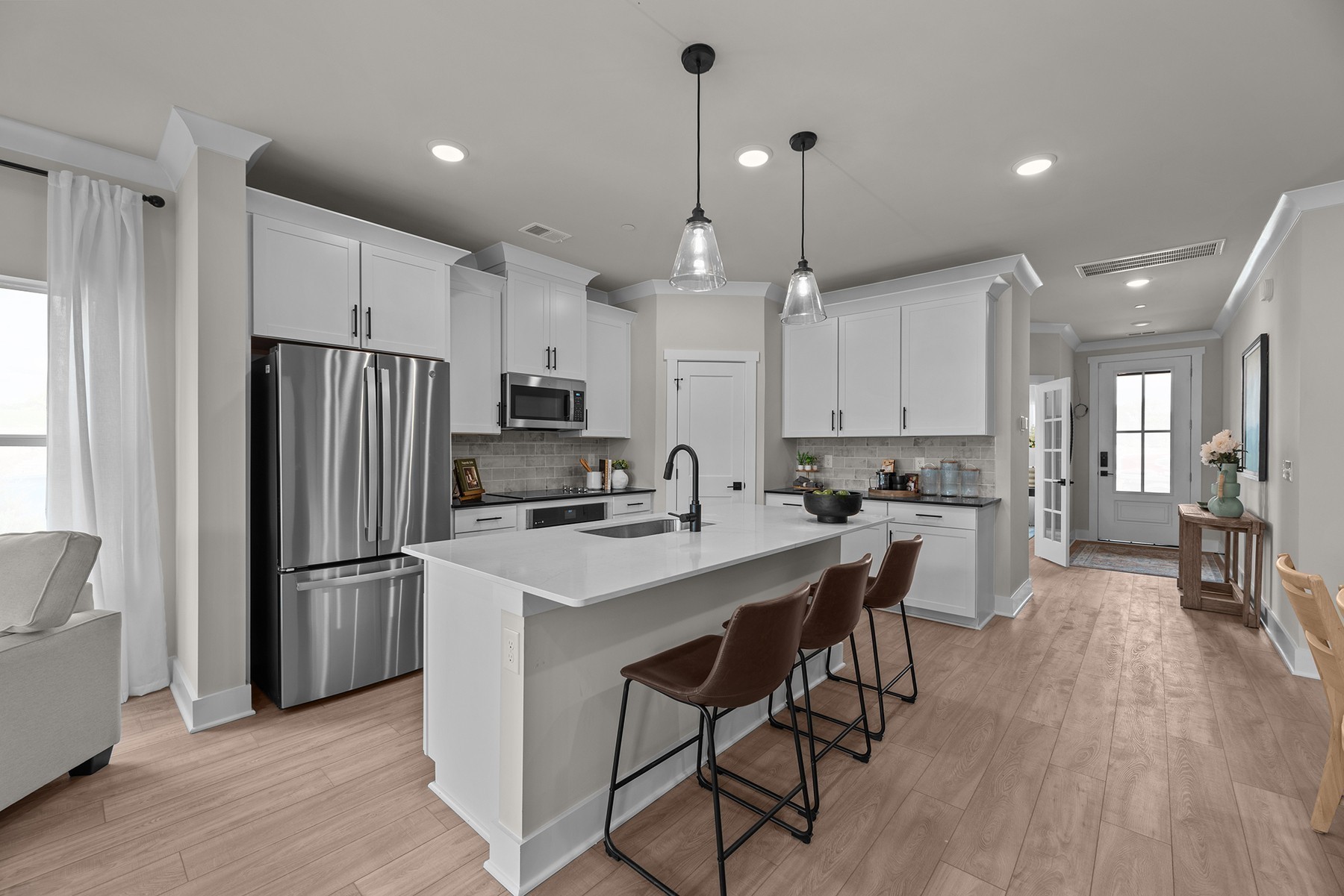 304 Strong Street Columbia, TN 38401 - Photo 23 of 49 a kitchen with stainless steel appliances granite countertop a refrigerator a sink dishwasher a stove and a refrigerator with wooden floor