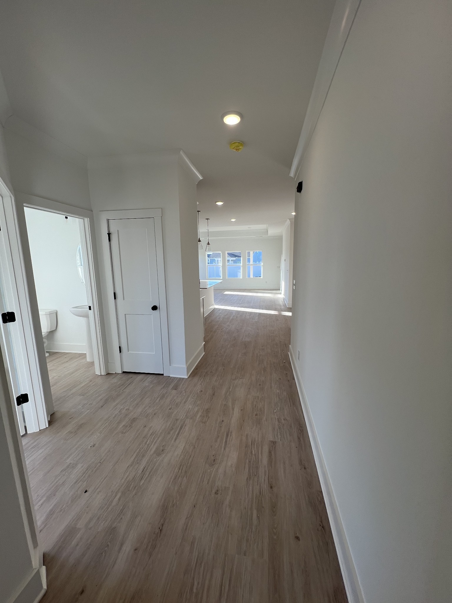 304 Strong Street Columbia, TN 38401 - Photo 8 of 49 a view of an empty room with wooden floor and a window