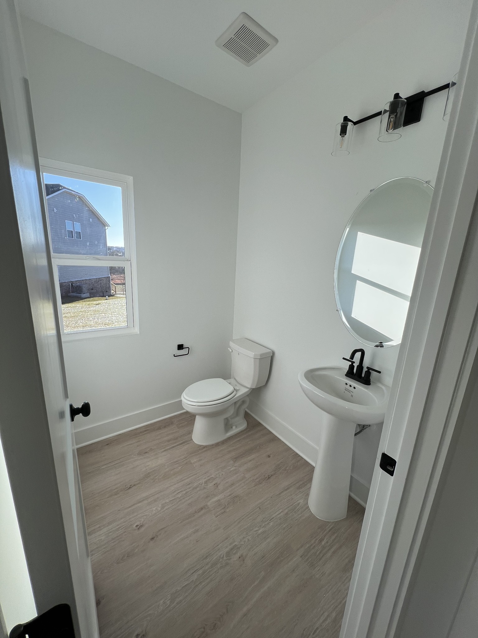 304 Strong Street Columbia, TN 38401 - Photo 10 of 49 a bathroom with a sink toilet and window