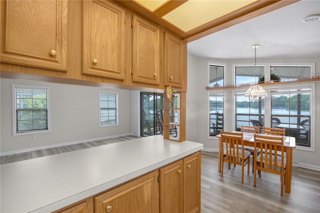 1230 Melton Road, Unit 25 West Union, SC 29696 - Photo 6 of 46 A sun-filled dining area boasts abundant windows, offering serene waterfront views.