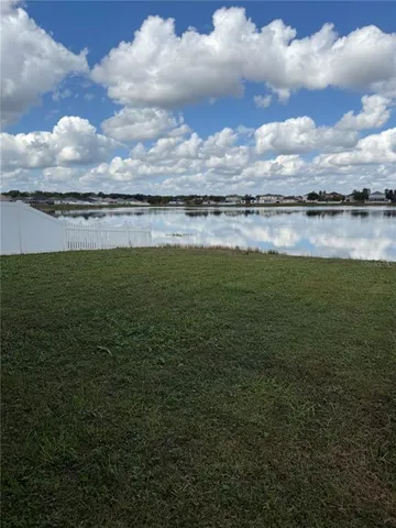 a view of a lake and a yard