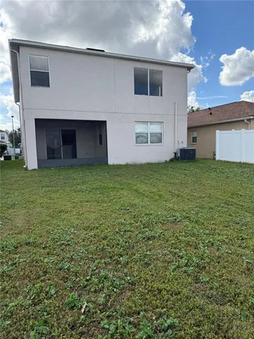 a view of a backyard of the house