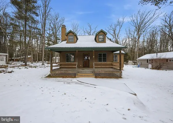 a view of a building with parking area