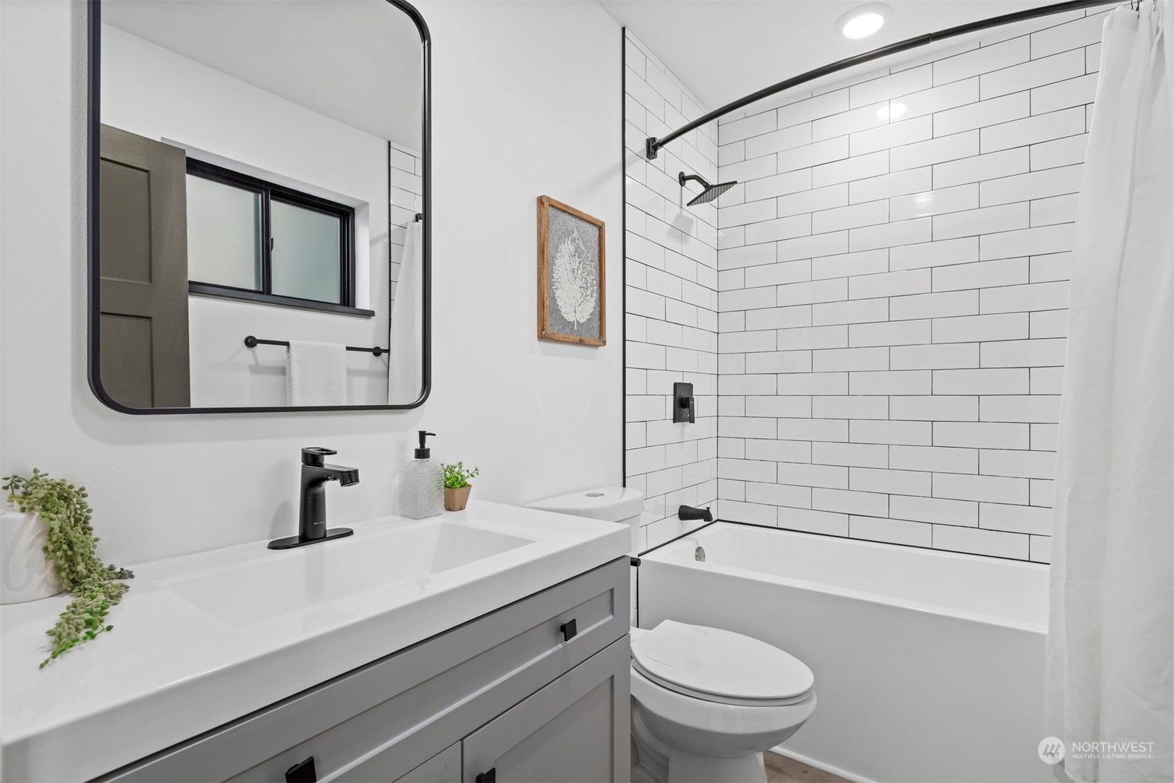 2415 Pacific Street Bellingham, WA 98229 - Photo 16 of 40 a bathroom with a sink a toilet and shower
