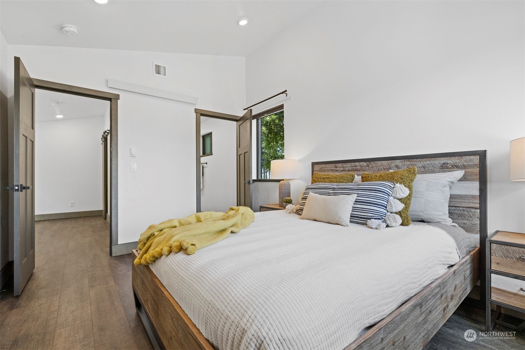 2415 Pacific Street Bellingham, WA 98229 - Photo 21 of 40 a bedroom with a bed and wooden floor