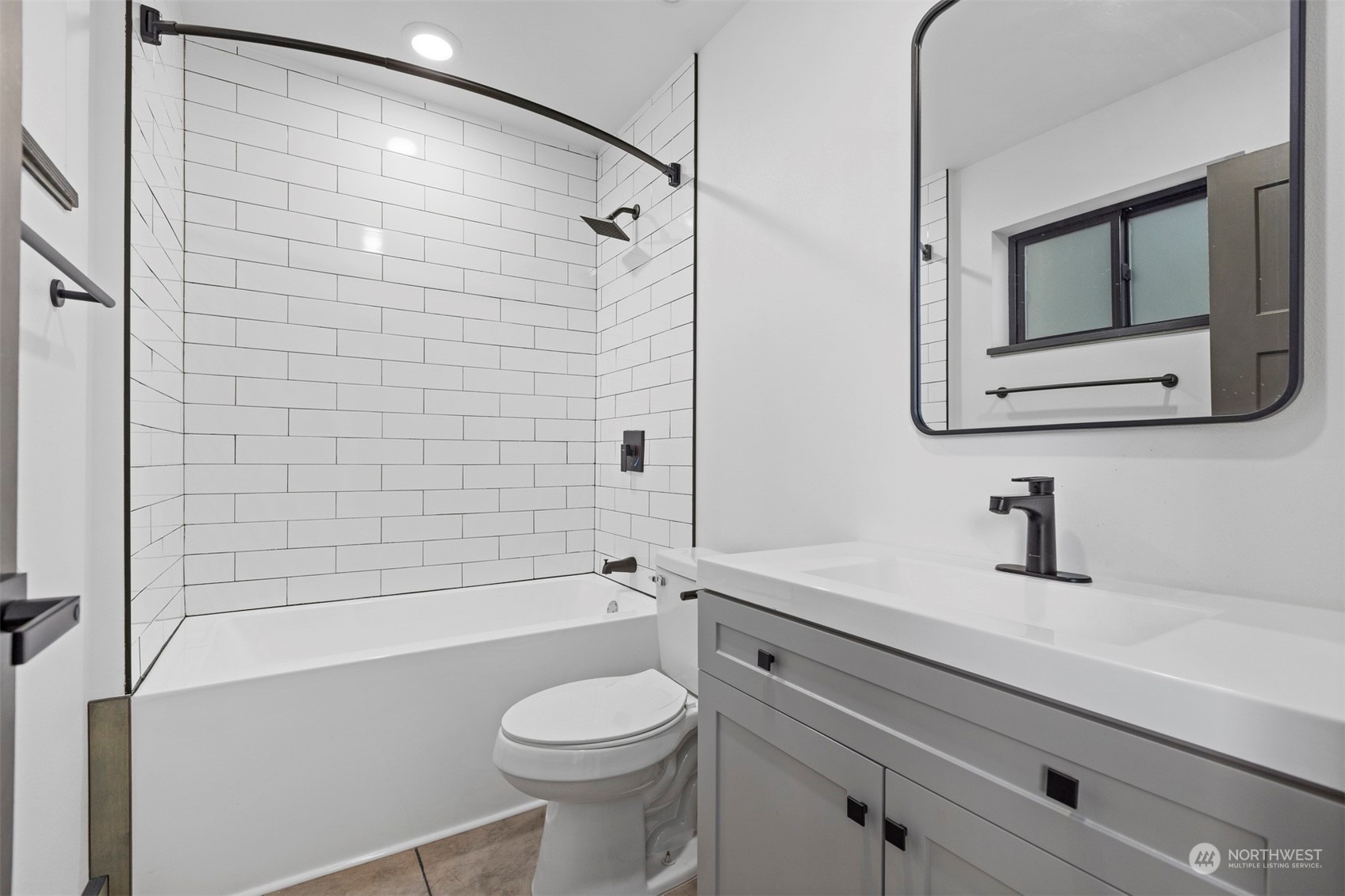 2415 Pacific Street Bellingham, WA 98229 - Photo 33 of 40 a bathroom with a toilet a sink and bathtub