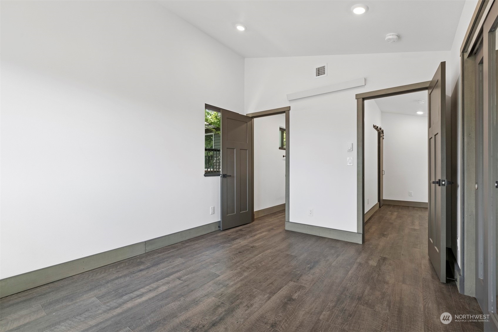2415 Pacific Street Bellingham, WA 98229 - Photo 35 of 40 an empty room with wooden floor and windows