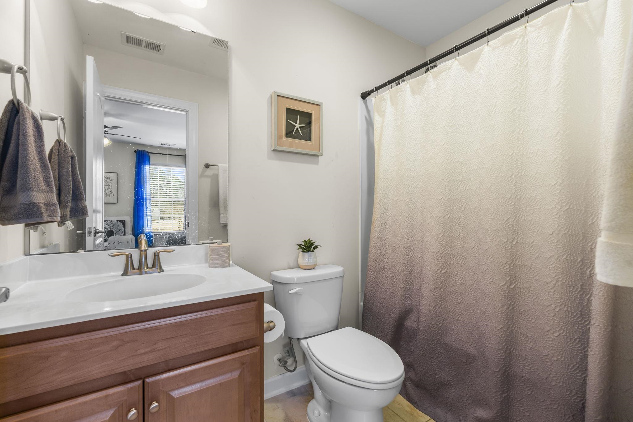 2015 Oxford Street Myrtle Beach, SC 29577 - Photo 28 of 40 Full bathroom featuring a shower with shower curtain, vanity, and ceiling fan