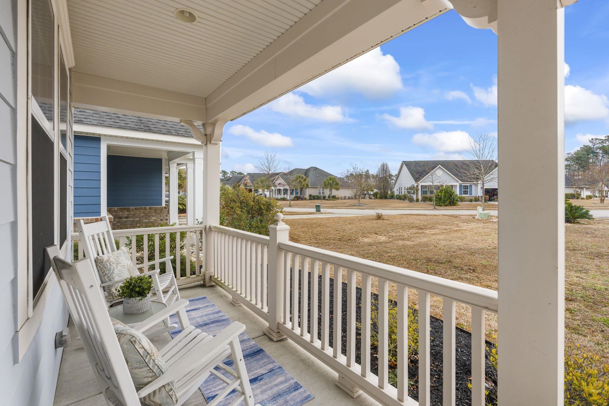2015 Oxford Street Myrtle Beach, SC 29577 - Photo 3 of 40 Covered porch with a residential view and a sunroom