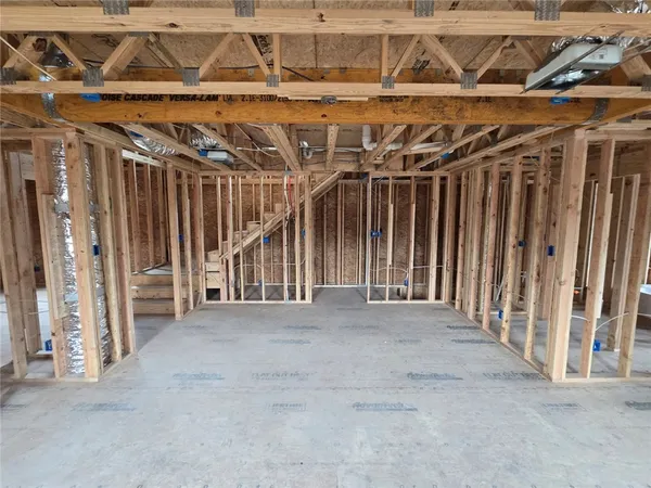 a view of an empty room with a windows