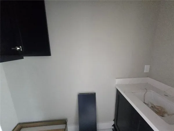 a kitchen with a stove a refrigerator and a sink