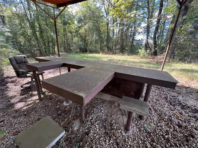 a view of a chairs and table on the deck