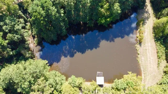 a view of a lake with a yard