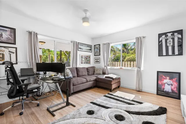 a bathroom with a double vanity sink toilet mirror and shower