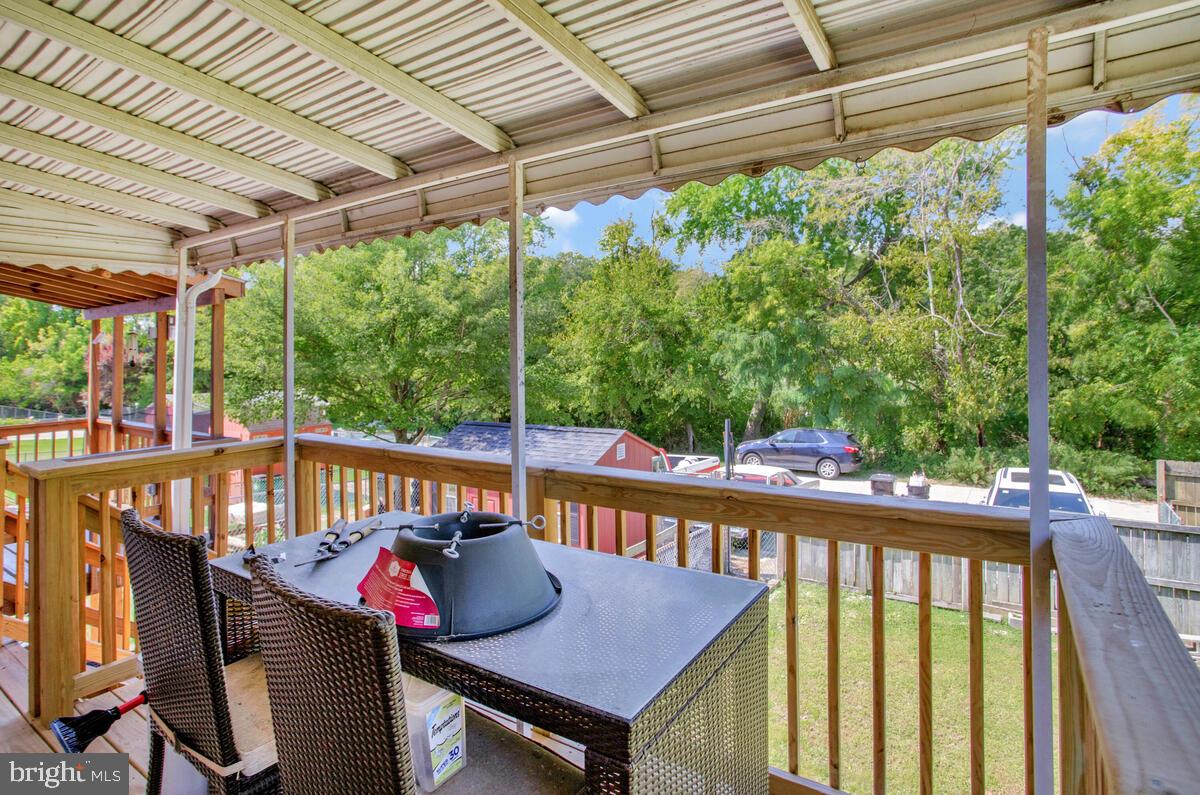 712 Seawall Road Baltimore, MD 21221 - Photo 15 of 36 Back Porch with View of Large Yard