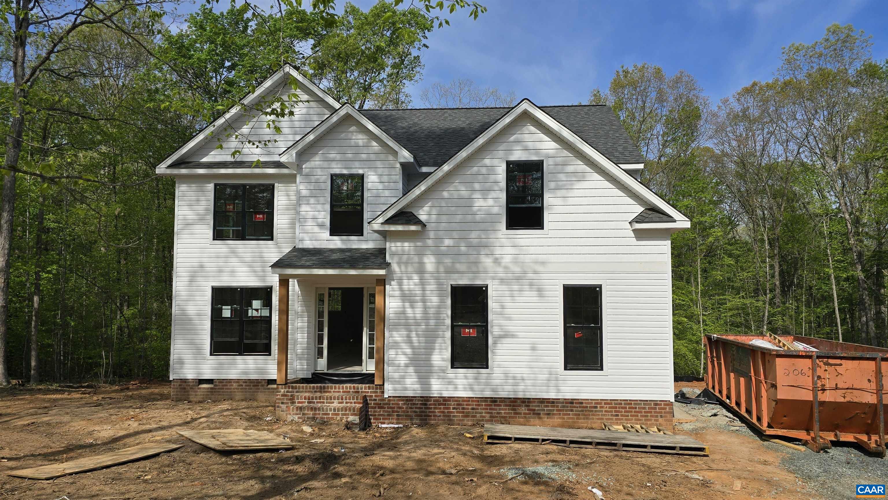 4245 Roundabout Road Louisa, VA 23093 - Photo 1 of 36 a front view of a house with yard