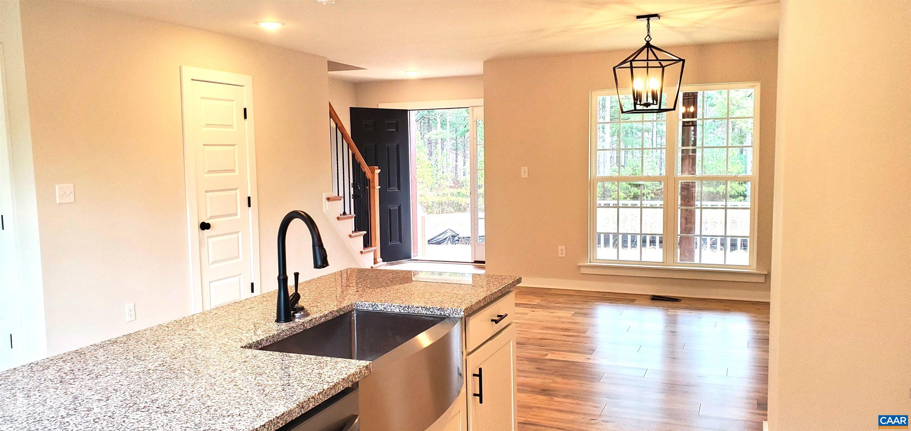 4245 Roundabout Road Louisa, VA 23093 - Photo 11 of 36 a kitchen with granite countertop a sink and a stove